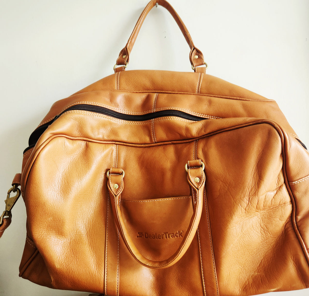 Latico Leathers Weekend Bag with Pockets says "Dealertrak"on one side