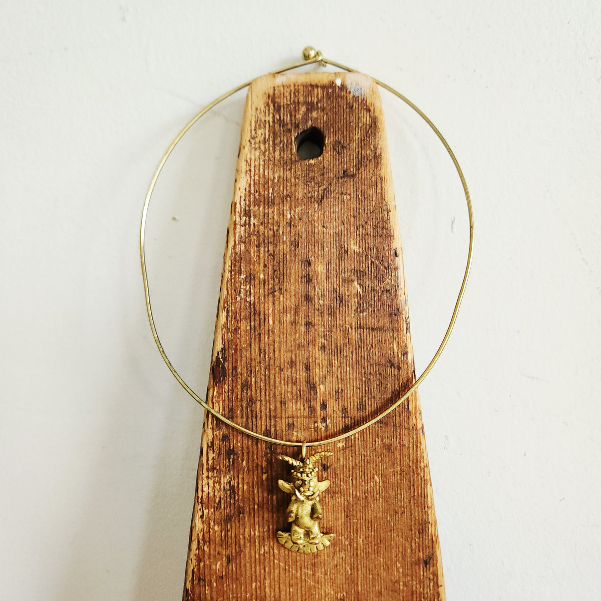 Structured Goldtone Collar Necklace with Mythical Figure Pendant