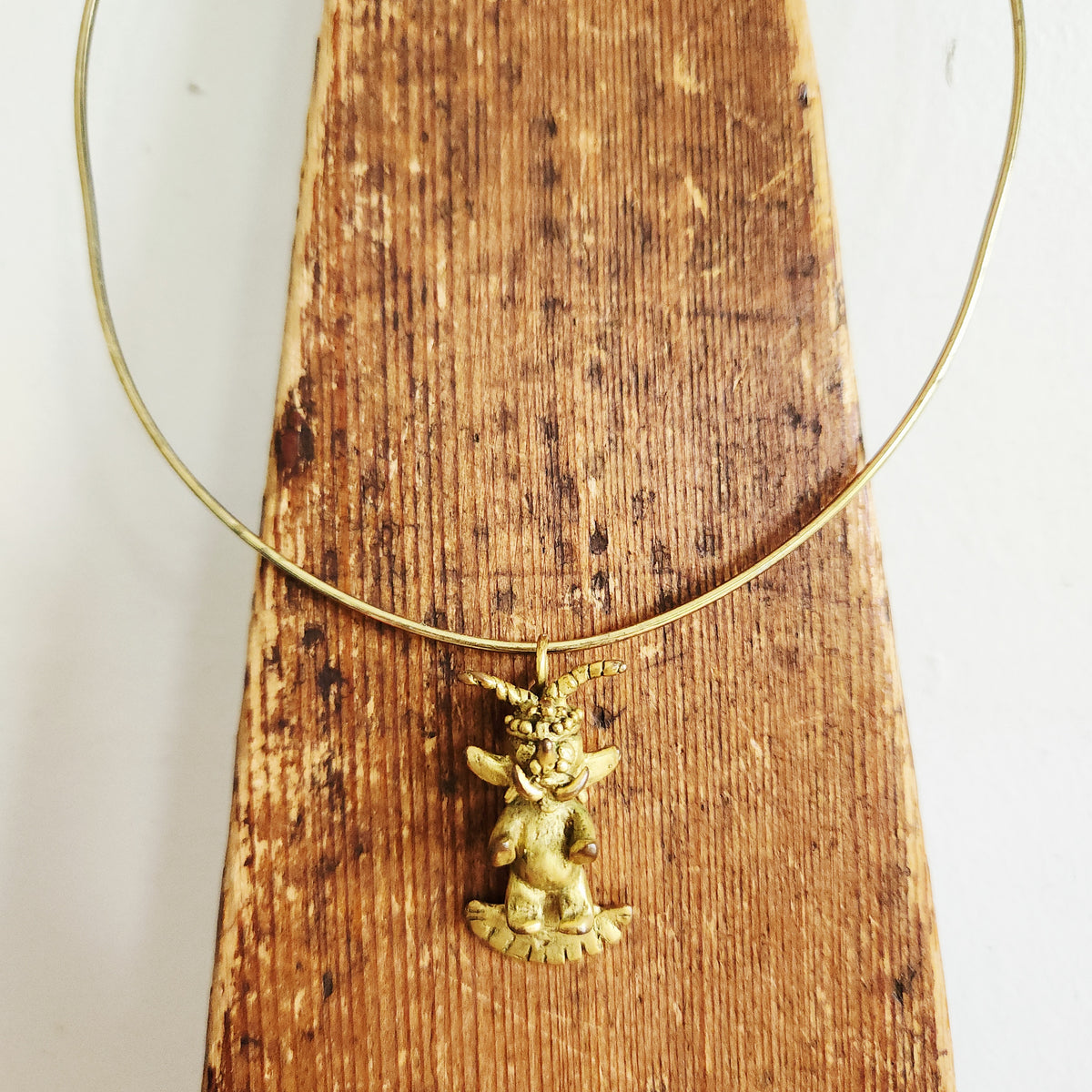 Structured Goldtone Collar Necklace with Mythical Figure Pendant