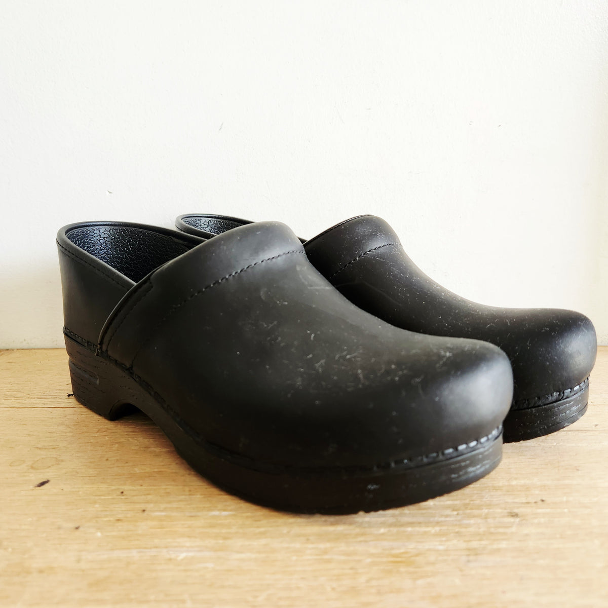 Dansko's Black Oiled Black Slip Ons Like New