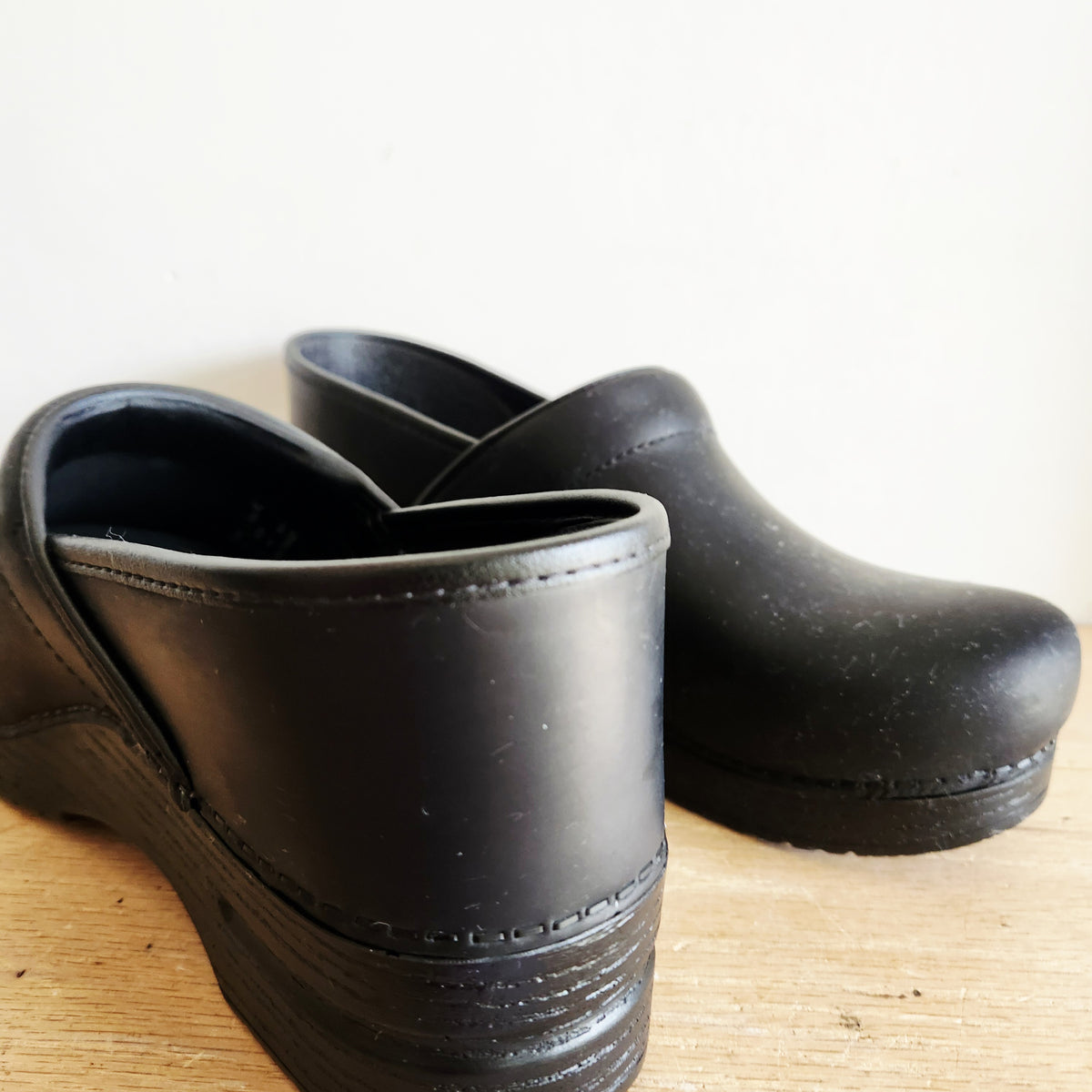 Dansko's Black Oiled Black Slip Ons Like New