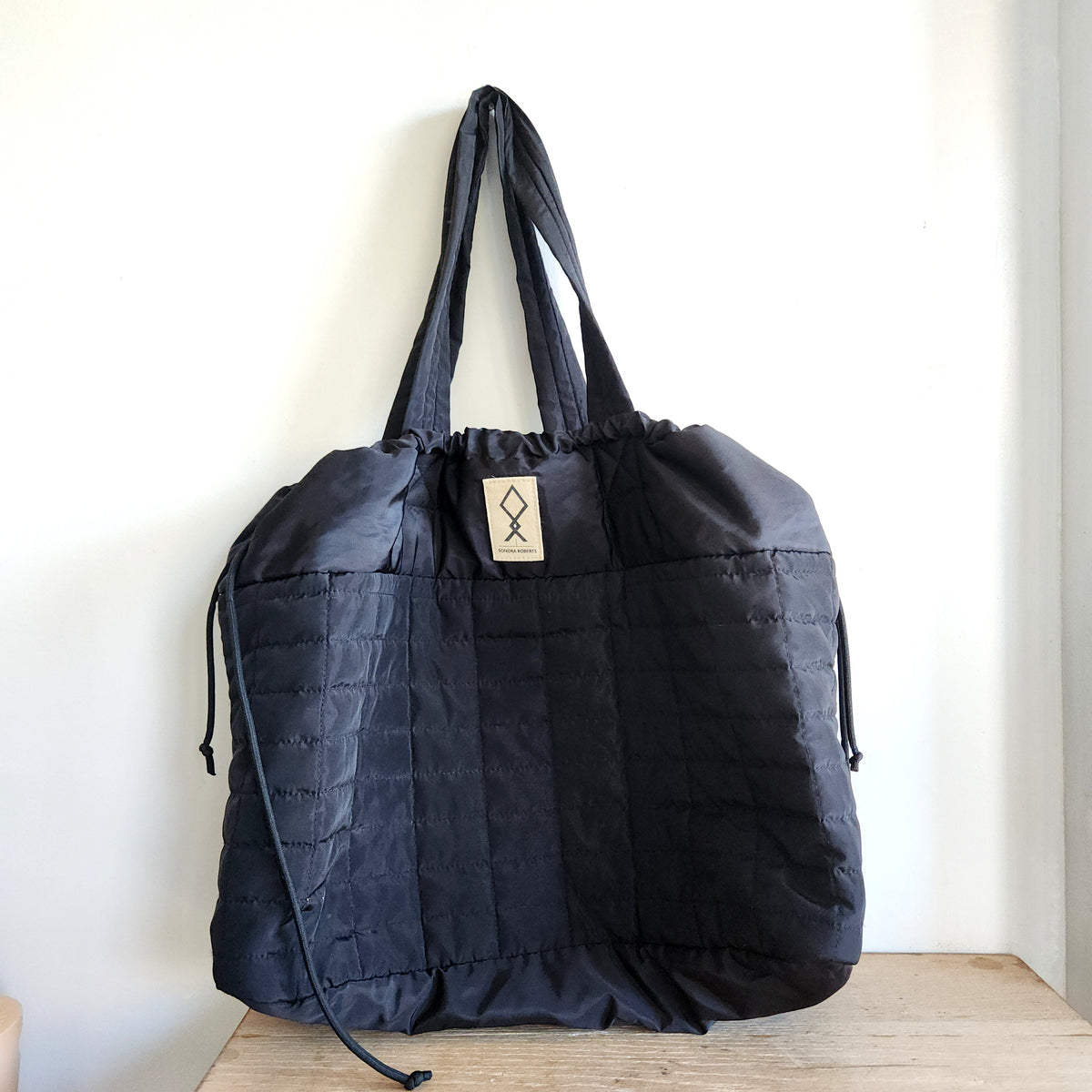 Sondra Roberts Black Quilted Drawstring Tote